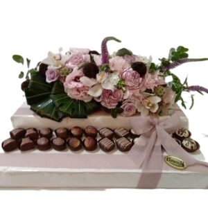 Grand, double-sided fresh flower arrangement with tray on 24 pc choc praline platform